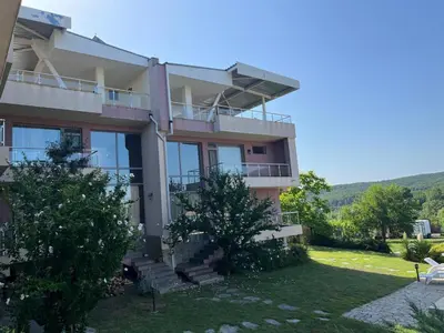 a villa with a view of a house at Sunny house in Pismenovo