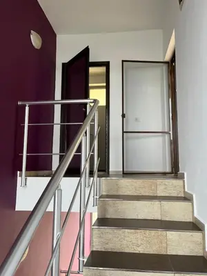 a staircase in a house with a glass door at Sunny house in Pismenovo