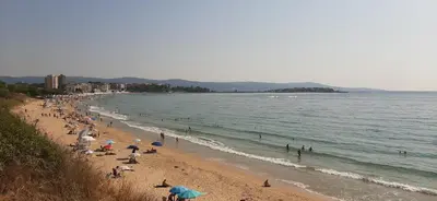 a group of people on a beach with the ocean at Sea Apartament Kristal Beach,Nessebar in Nesebar