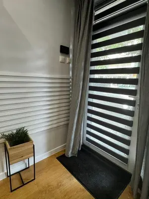 a room with a window with blinds at Casa Raffaelo in Burgas City