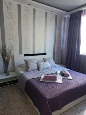 a bedroom with a bed with a tray of food on it at Guest House Dani in Pomorie