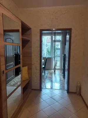 a hallway with a door open to a living room at Guest House Dani in Pomorie