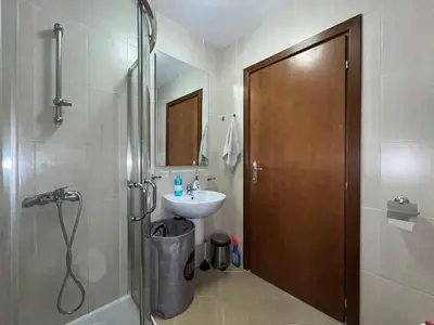 a bathroom with a shower and a sink and a toilet at Apartament Studio Bułgaria Garden Of Eden in Sveti Vlas