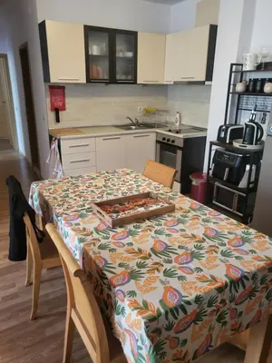 a kitchen with a table with a table cloth on it at Vineyard luxery spa resort in Kableshkovo