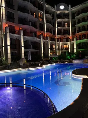 a large swimming pool in front of a building at Harmony Grand Resort - Apartament Gut in Sunny Beach