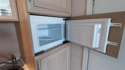 a microwave oven on top of a kitchen cabinets at Luxuriöse Ferienwohnung im Harmony Suites Monte Carlo in Sunny Beach