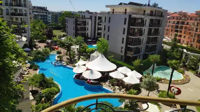 an aerial view of a water park with umbrellas at Luxuriöse Ferienwohnung im Harmony Suites Monte Carlo in Sunny Beach