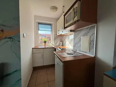 a small kitchen with a sink and a microwave at BW - Aquamarin C6 in Sunny Beach