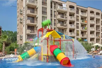 a water park with a water slide in a pool at Cascadas Family Resort apartment pool view in Sunny Beach