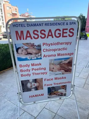 a sign sitting on the side of a sidewalk at Прекрасно място за нощувки в Слънчев бряг in Sunny Beach