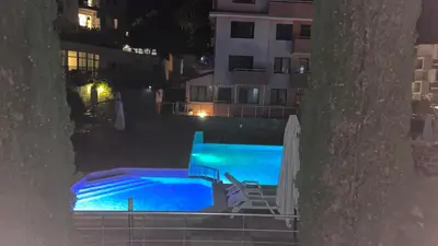 a view of a swimming pool at night at Luxus und Komfort im Vista Residence Komplex in Sveti Vlas