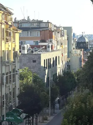 a street in a city with buildings and trees at Victoria- две спални делукс до Морската градина и центъра in Burgas City