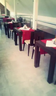 a row of tables and chairs in a restaurant at Concordia Plaza 2 in Primorsko