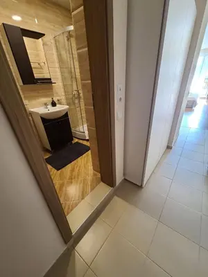 a bathroom with a sink and a mirror at Privet apartament in Premier Fort in Sveti Vlas