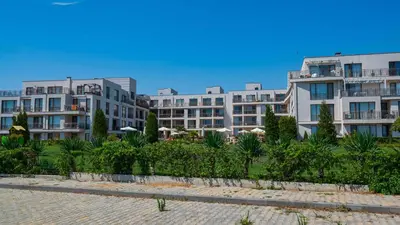 a row of apartment buildings in a resort at June Sea view Studio Apartment in Burgas City
