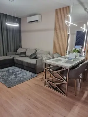 a living room with a couch and a table at Harmony Suites 16 in Sunny Beach