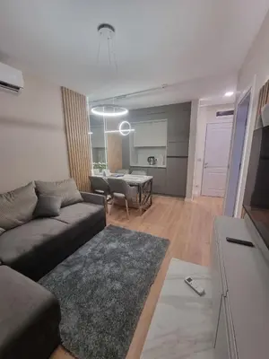 a living room with a couch and a table at Harmony Suites 16 in Sunny Beach