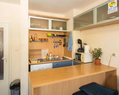 a small kitchen with a counter and a sink at LAZUR - Nice Sunny Flat in Burgas City
