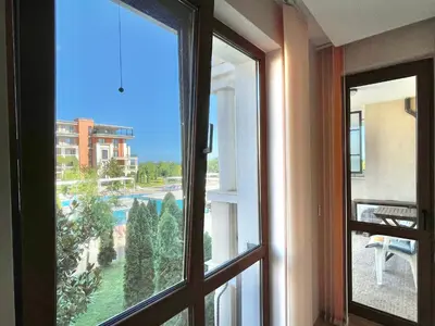 an open window with a view of a pool at Prestige Fort Aparthotel - Private apartment - BSR - 1 in Sveti Vlas