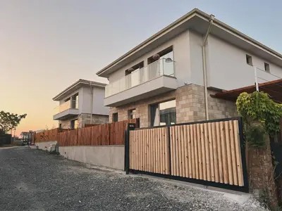 a house with a fence in front of it at Dimargo in Lozenets