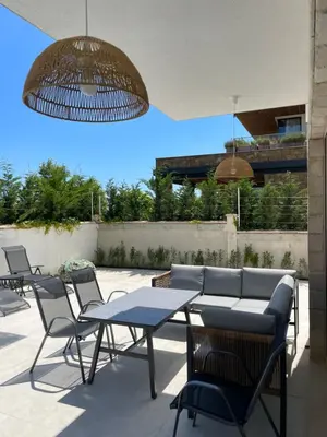 a group of tables and chairs on a patio at Dimargo in Lozenets