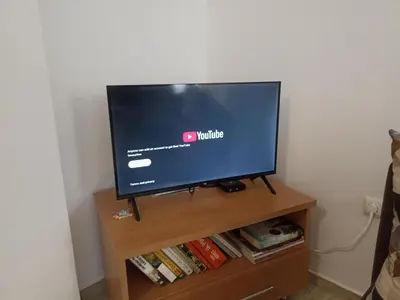 a flat screen tv sitting on top of a tv stand at SilverSprings Lucie in Sunny Beach
