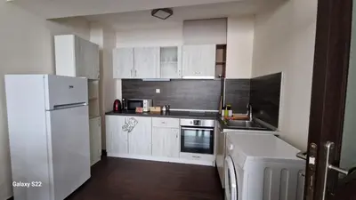 a kitchen with white cabinets and a white refrigerator at De Ja Vu- Zdravez in Burgas City