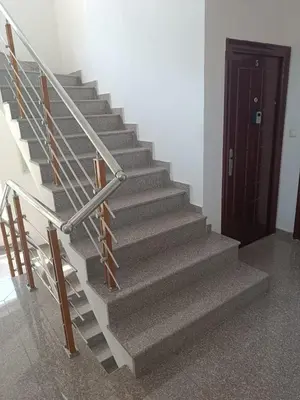 a set of stairs with a door in a room at Sunny Beach Apartment, Kokiche Hotel - white building Liliya in Sunny Beach