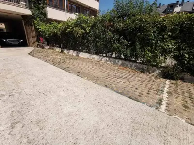 a sidewalk in front of a building at Delux Apart Vulchevi with Parking in Burgas City