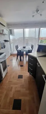 a kitchen with a ping pong table in a room at Unique Apartment with Balcony in Pomorie Old Town by Flat Mаnаger in Pomorie