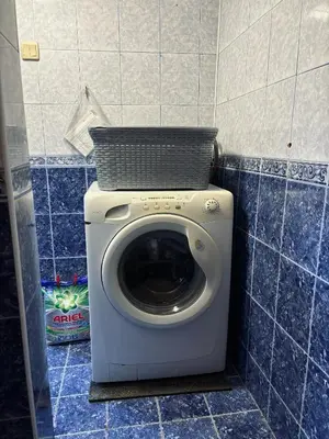 a washing machine with a basket on top of it at Вила 50 in Atiya