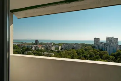 a view of a city from a window at Lazur Sea View in Burgas City