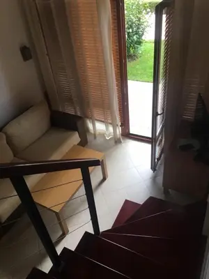 a living room with a couch and a window at Private apartments Ravda-Emerald in Ravda