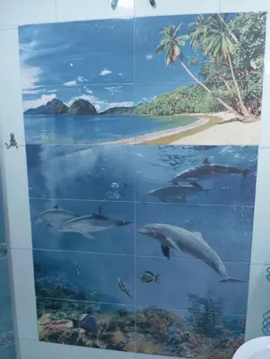 a collage of dolphins swimming in the ocean at Apartament ALBATROS in Burgas City
