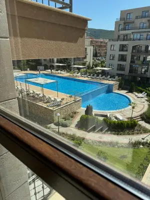 a view of a swimming pool from a window at Sorrento Sole Mare Studio Appartment in Sveti Vlas