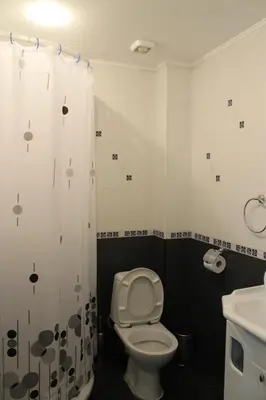 a bathroom with a toilet and a sink at Stela Guest House in Tsarevo