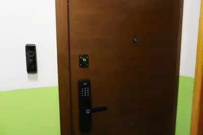 a close up of a wooden door in a room at Azur Holiday Burgas - self check-in in Burgas City