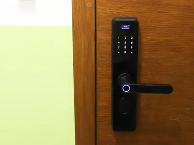 a black door handle on a wooden door at Azur Holiday Burgas - self check-in in Burgas City