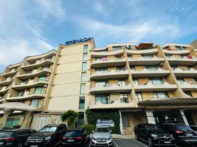 a large building with cars parked in front of it at GRENADA 322C Studio Sunny Beach in Sunny Beach