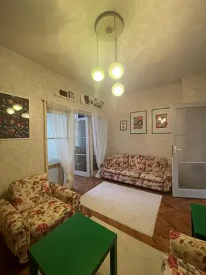a living room with a couch and a table at BOHO Apartment in Varna City