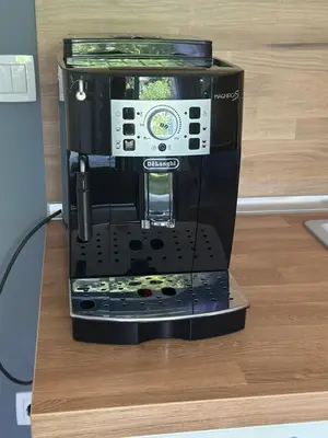 a black coffee maker sitting on top of a table at Romantic City Central Apartment in Varna City