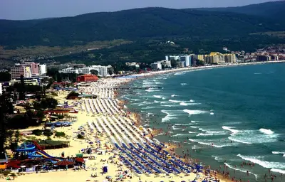 a beach with a lot of people and the ocean at Sunny Beach Victoria Penthouse in Sunny Beach