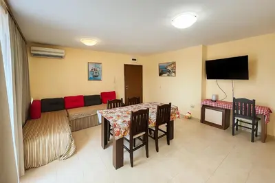 a living room with a couch and a table at Sunny Beach Victoria Penthouse in Sunny Beach