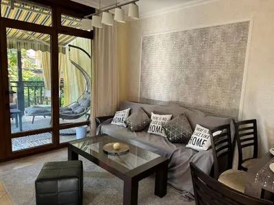 a living room with a couch and a table at Niko's Apartment in Sozopol