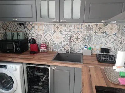 a kitchen with a sink and a washing machine at Apartment Black Sea Center 1 in Varna City