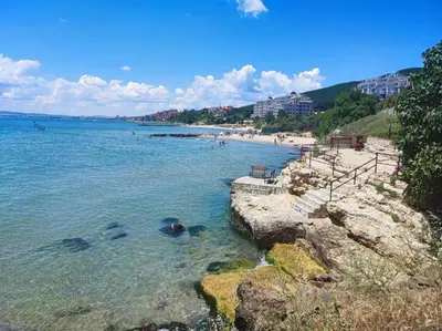 a beach with people swimming in the water at Fort Noks Panorama in Elenite