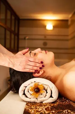 a woman getting a massage in a room at Emerald Beach Resort & Spa in Ravda