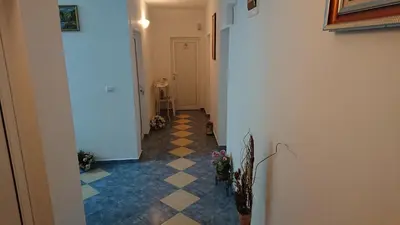 a hallway with a checkered floor at Sianie Guest House in Ravda