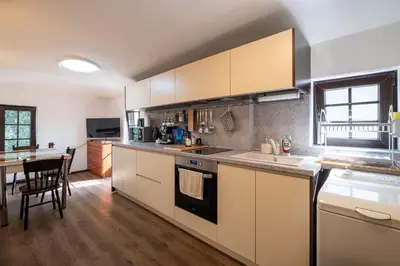 a kitchen with a sink and a stove top oven at Seagull Apartment in Varna City