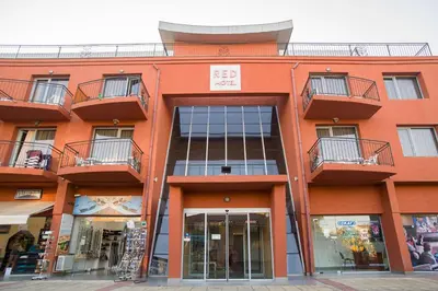 an orange building with balconies on top of it at The Red Lozenets in Lozenets